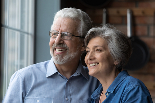 2 elderly adults smiling